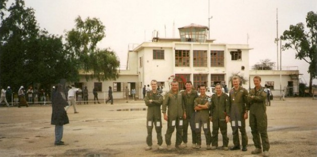 South African and Rhodesian pilots pose in front of Hargeisa terminal in 1988 after a killing sortie